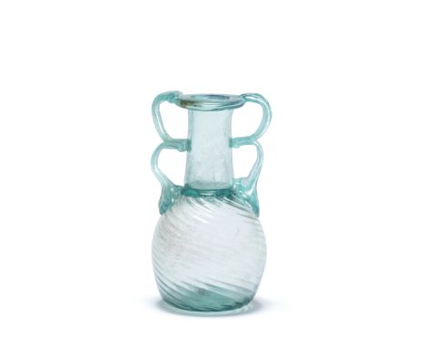  A Roman turquoise glass two-handled ribbed sprinkler flask Circa late 3rd-4th Century A.D.13.6cm high Footnotes:Provenance:w