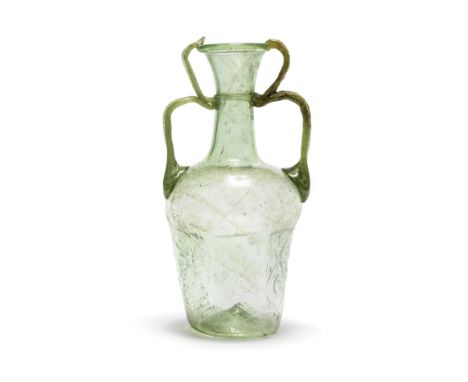  A Roman green glass hexagonal two-handled flask Circa late 6th-early 7th Century A.D.18cm high Footnotes:Provenance:with Abr