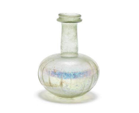  A large Roman pale green glass ribbed flask Circa 4th-early 5th Century A.D.25cm high Footnotes:Provenance: Anonymous sale; 