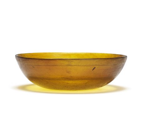  A Roman amber cast glass bowl with wheel-cut bands Circa late 1st Century B.C.– early 1st Century A.D.15.5cm diam.Footnotes: