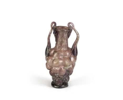  A Roman aubergine glass grape flask Circa late 1st-2nd Century A.D.9.5cm highFootnotes:Provenance:Anonymous sale; Millon Auc