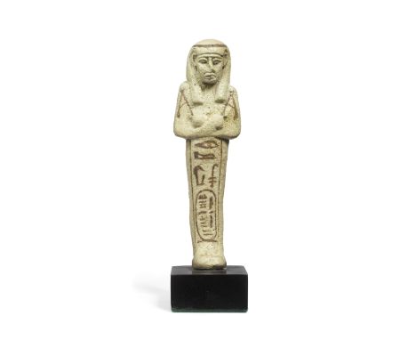  An Egyptian pale green glazed faience shabti for Takelot II  Third Intermediate Period, 22nd Dynasty, circa 841-816 B.C.13.6