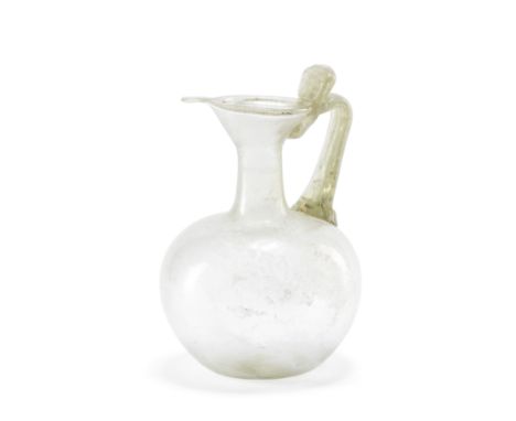  A Roman colourless glass spouted jug Circa 2nd Century A.D.15.4cm high Footnotes:Provenance:With Archea Ancient Art, Amsterd