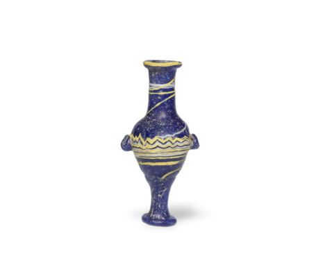  A Greek core-formed glass unguentarium Circa 3rd Century B.C.9.7cm high Footnotes:Provenance: The Alfred Wolkenberg (d. 1990