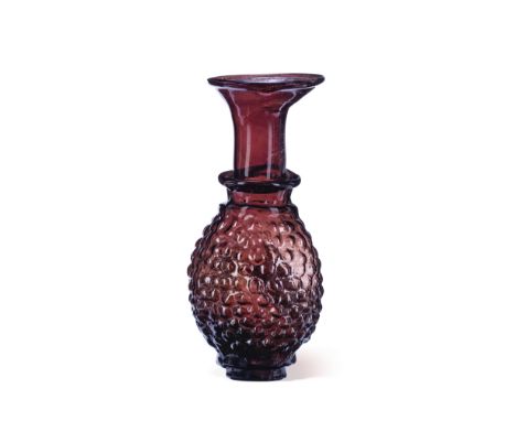  A Roman aubergine glass grape flask Circa 3rd Century A.D.13.9cm high Footnotes:Provenance:with Archaeological Center, Jaffa