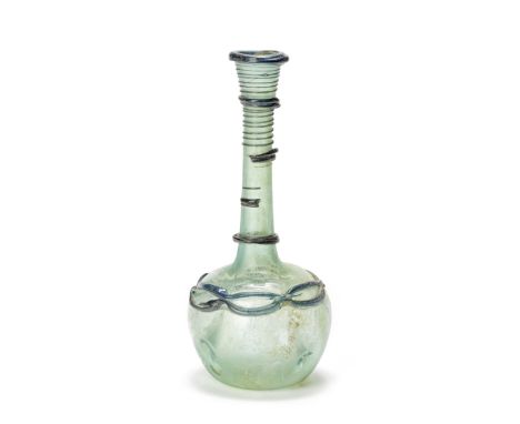  A Roman blue-green glass flask with internal threads Circa 5th-6th Century A.D.19.8cm high Footnotes:Provenance:The Alfred W