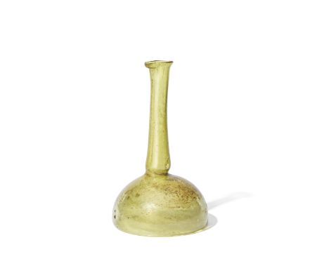  A Roman yellow glass unguentarium with concave base Circa 3rd Century A.D.14.3cm highFootnotes:Provenance:with Sheppard and 