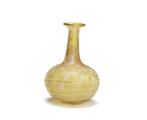  A Roman yellow glass bottle with opaque white trail Circa early 1st Century A.D.8.1cm high Footnotes:Provenance: C.A. Hessin