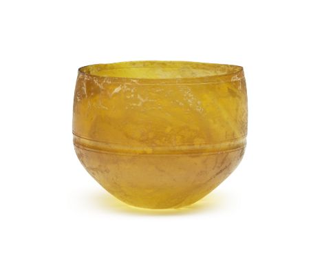  A Roman amber glass Hofheim cup Circa mid 1st Century A.D.7.2cm high, 8.6cm diam.Footnotes:Provenance:Herzer &amp; Co., Muni