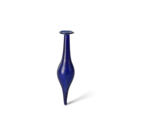  A Roman cobalt blue glass unguentarium  Circa 1st Century A.D.10.5cm high Footnotes:Provenance:Anonymous sale; Millon &amp; 