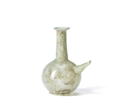  A Roman pale green glass lamp filler Circa 3rd-4th Century A.D.12cm high Footnotes:Provenance:Private collection, France, fo