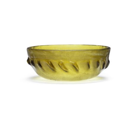  A Greek olive green glass ribbed bowl Hellenistic Period, circa late 2nd-1st Century B.C.12.8cm diam.Footnotes:Provenance:P.