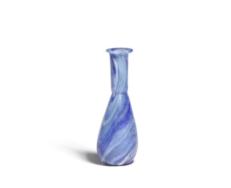  A Roman blue and white marbled glass unguentarium Circa 1st Century A.D.9.5cm highFootnotes:Provenance:Anonymous sale; Chris