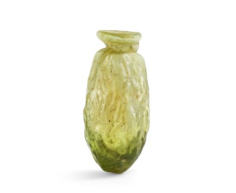  A Roman green and white glass date flask  Circa mid 1st-early 2nd Century A.D.6.4cm highFootnotes:Provenance: Anonymous sale