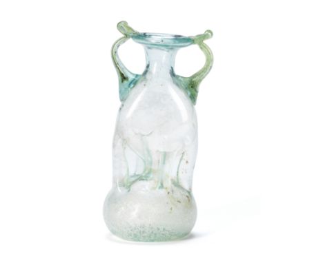  A Roman pale blue glass kuttrolf with blue-green handles Circa 3rd-4th Century A.D.13.3cm high Footnotes:Provenance:with Gil