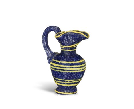  A miniature Greek core-formed glass oinochoe Circa 4th Century B.C.5.7cm high Footnotes:Provenance:Lord Dayton of Corran col