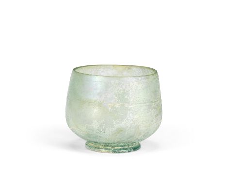  A Roman blue-green glass wheel-cut cup Circa 1st Century A.D.6.9cm high Footnotes:Provenance: The Cecil L. Hunt collection.A