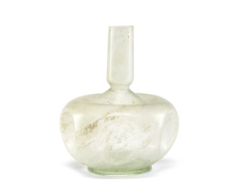  A Roman almost colourless wheel-cut glass flask Circa 2nd-3rd Century A.D.12.3cm highFootnotes:Provenance: Anonymous sale; C