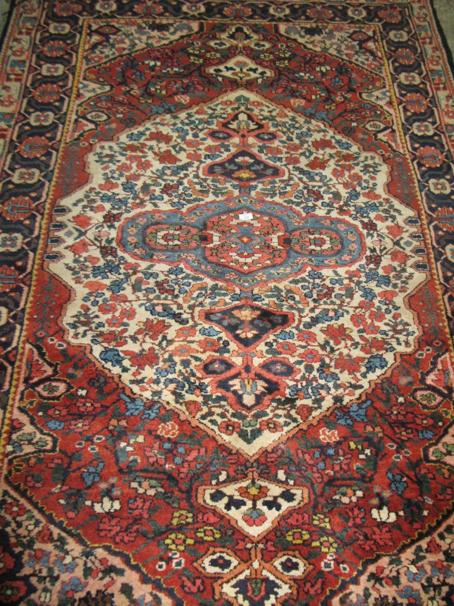 Very colourful Middle Eastern carpet with decoration of flora, fauna