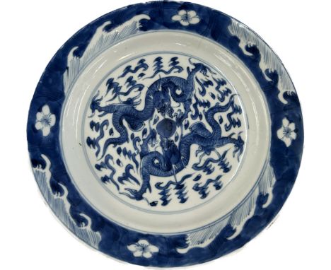 Antique Chinese blue and white plate decorated with dragons, possibly Kangxi diameter approx 21 cm