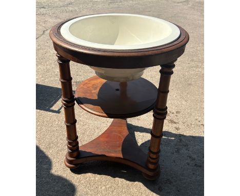 Victorian mahogany wash stand with porcelain basin measures approx 31 inches tall by 24 diameter 