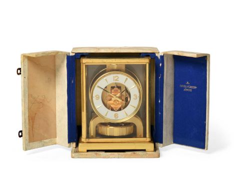 A Brass Atmos Clock, signed Jaeger LeCoultre, 20th century, five glass panelled case, base with spirit level, Arabic and dagg