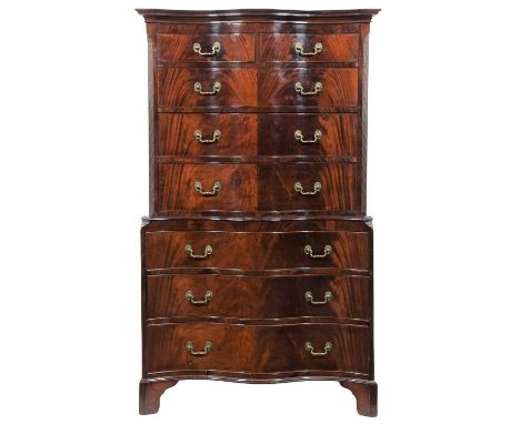 A Late George III Mahogany Serpentine Shaped Chest on Chest, early 19th century, the moulded cornice above two short and thre