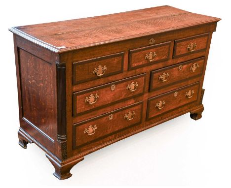 A George III Oak and Mahogany Crossbanded Lancashire Mule Chest, late 18th century, the moulded top above three dummy and fou