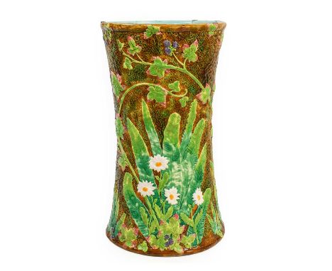 A George Jones Majolica Stick Stand, circa 1870, of waisted cylindrical form, modelled as a tree trunk with flowering and fru