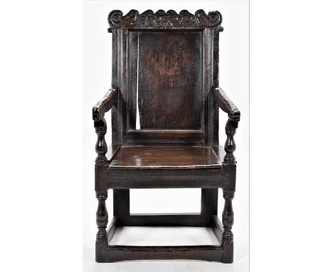 A Joined Oak Westmorland Wainscot Armchair, initialled and dated 1699, the moulded back support above an adapted hinged seat 