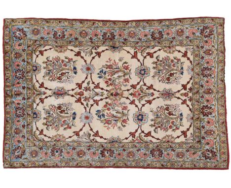 Unusual Qum RugCentral Iran, 2nd half 20th centuryThe ivory field with a one-way design of semi-naturalistic floral sprays en