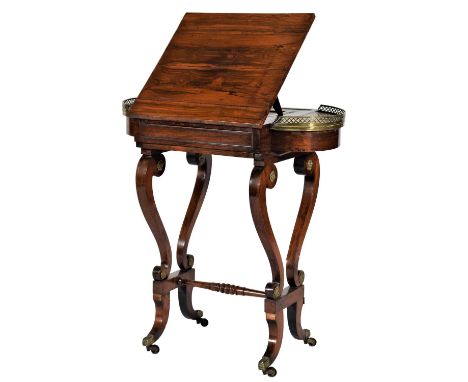 A Regency Rosewood and Gilt Metal Mounted Writing/Games Table, early 19th century, the sliding top adjustable ratchet support