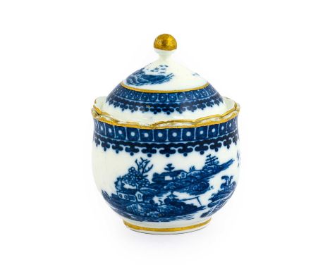A Caughley Porcelain Artichoke Cup and Cover, circa 1790, of ovoid form with scalloped rim, printed in underglaze blue with t