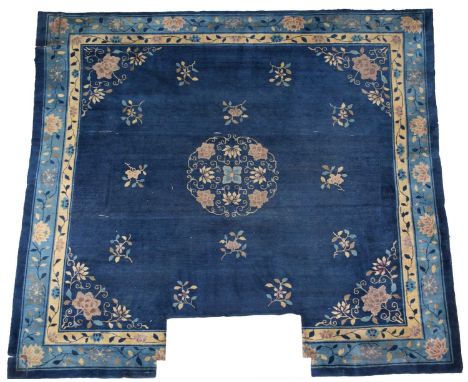 Chinese Carpet, 19th centuryThe deep indigo field with floral sprays around a medallion framed by spandrels and sky blue bord