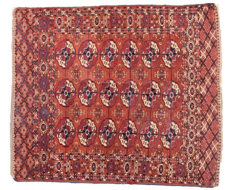 Tekke RugEmirate of Bukhara, circa 1890The madder field with three columns of quartered guls enclosed by borders of geometric