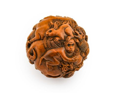 A Japanese Carved Hardwood Netsuke, Meiji period, of ball form, worked in relief with a profusion of animals, 4cm diameterCon
