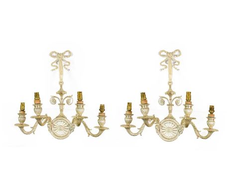 A Pair of Silvered-Metal Four-Light Wall Sconces, in George III style, with ribbon-tied cresting, urn shaped column and pater