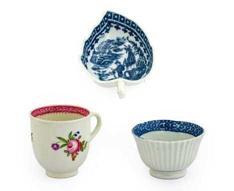 A Caughley Porcelain Tea Bowl, circa 1785, of fluted ogee form, printed in underglaze blue with a cell border, printed C mark