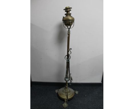 An Art Nouveau brass standard lamp 