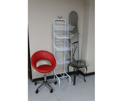 A folding metal cheval mirror, office chair, metal display stand with wire mesh baskets and a glass topped lamp table. 