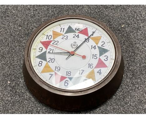 A Bakelite cased circular wall clock with later 'RAF' sector dial