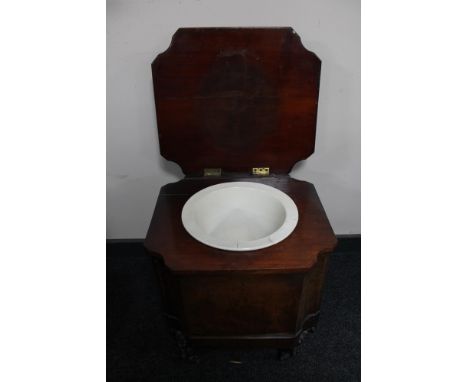 A Victorian mahogany commode on scroll legs. 