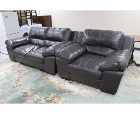 A brown leather two seater settee with armchair. 