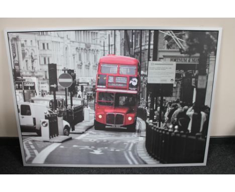 A large Ikea framed print of a London bus 
