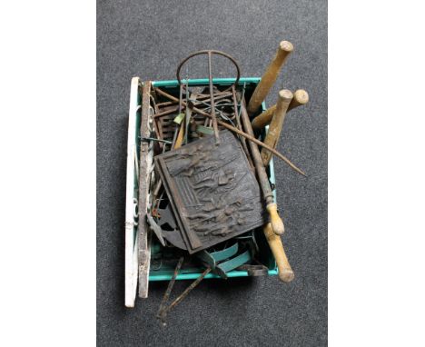 A box of antique and later metal ware, garden wall brackets, fire grate, cast iron plaque, gardening tools etc 