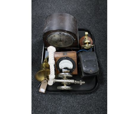 A tray of oak cased Art Deco mantel clock, brass ship's bell, miniature metal cannon, wooden cased voltmeter etc 