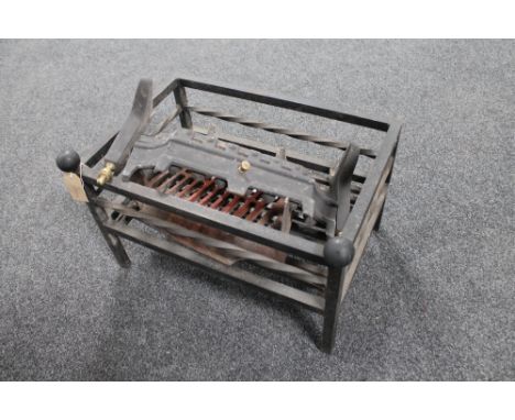 A cast iron fire basket and a fire grate 
