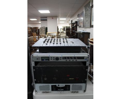 A flight case containing a Crown LPS 2500 power amplifier, a Lem Digital DX24 40 bit digital loud speaker processor, Mos-SET 