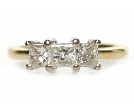 EIGHTEEN CARAT GOLD DIAMOND THREE STONE RINGset with princess cut diamonds totalling approximately 0.95 carats, size K, 4g