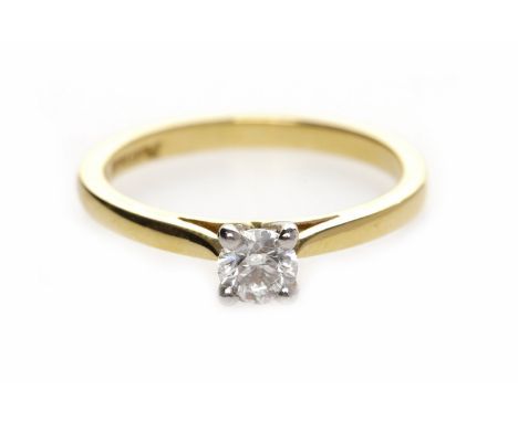 EIGHTEEN CARAT GOLD DIAMOND SOLITAIRE RINGwith a four claw set round brilliant cut diamond of approximately 0.27 carats, size